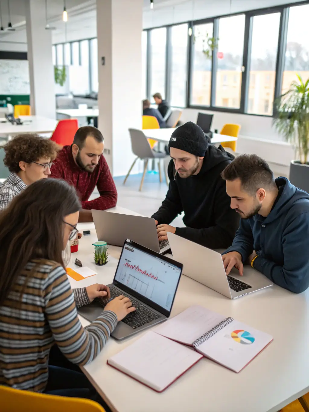 A professional, brightly lit photograph of a modern software development team collaborating in an open office space, reflecting the SaaS industry.